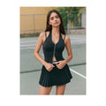 Black double-zip halter active top styled for tennis court wear