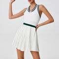 Front view of women's pleated zip tennis dress