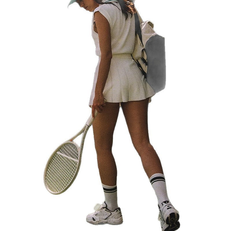 White tennis vest and pleated skirt outfit