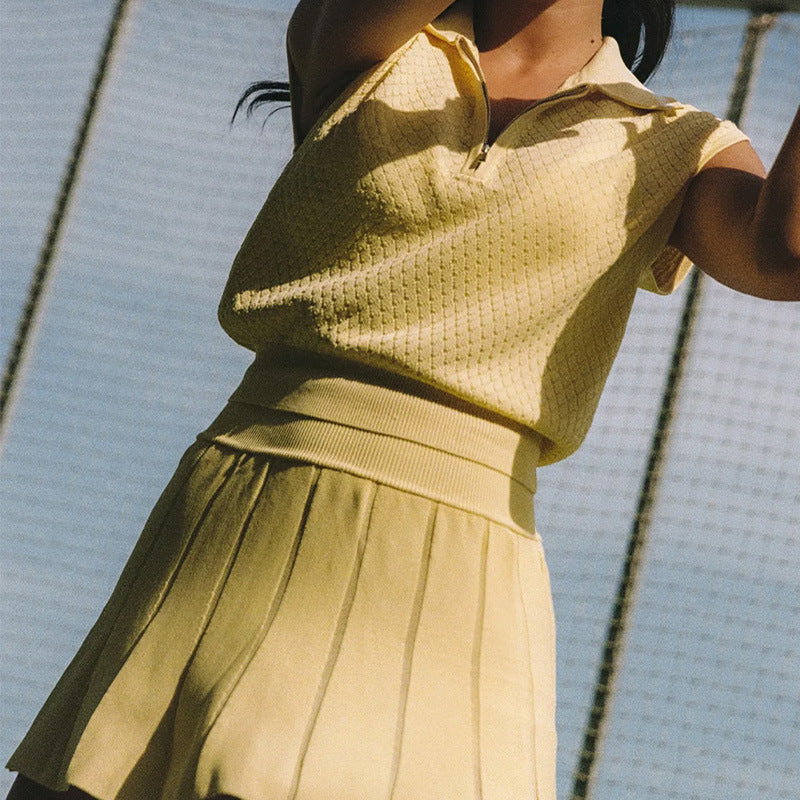 Yellow jacquard tennis vest and pleated skirt