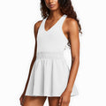 Woman wearing white V-neck tennis dress